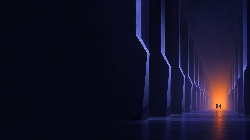 Two figures walking down a long colonnade of angular pillars toward an orange light