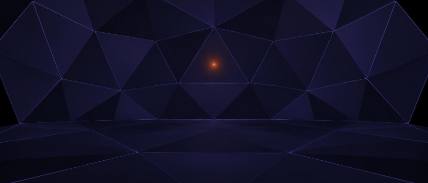 The inside of a faceted enclosure with one small orange light at its center